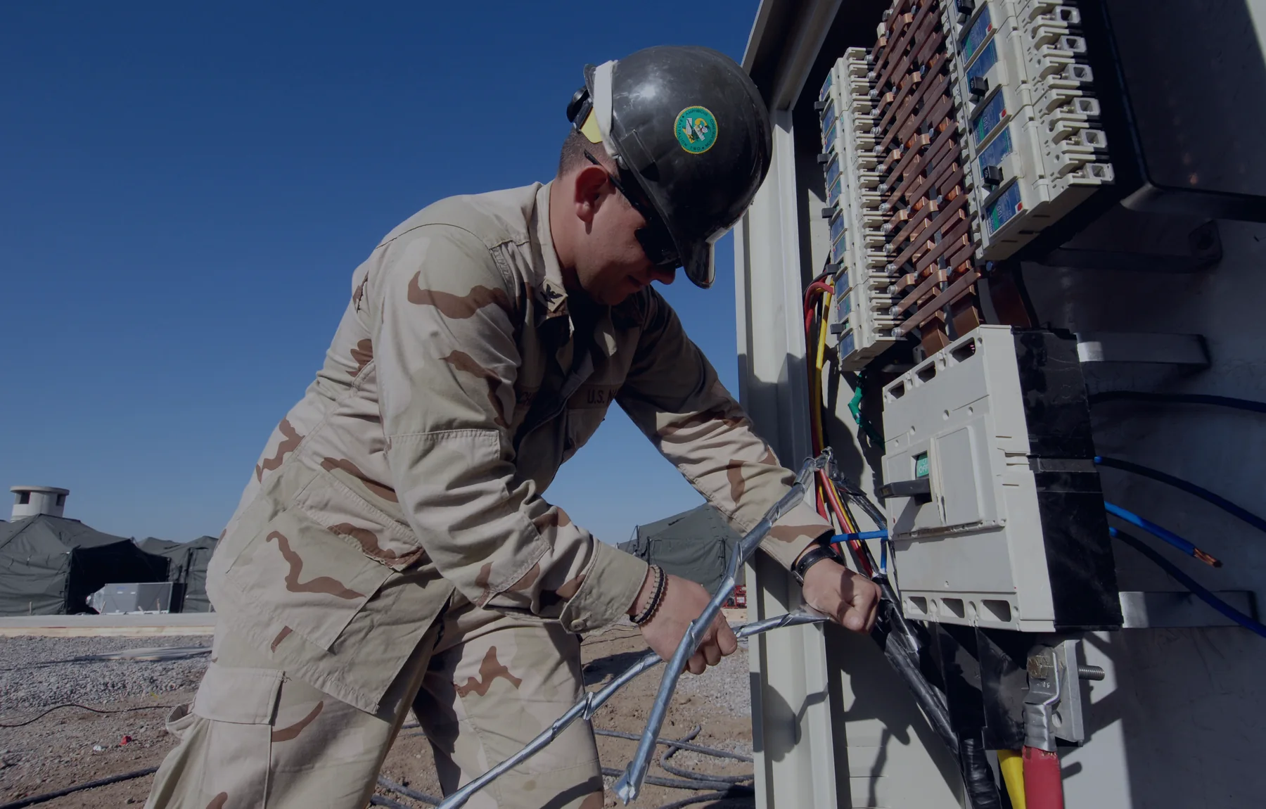 Electrician wiring a professional electrical panel